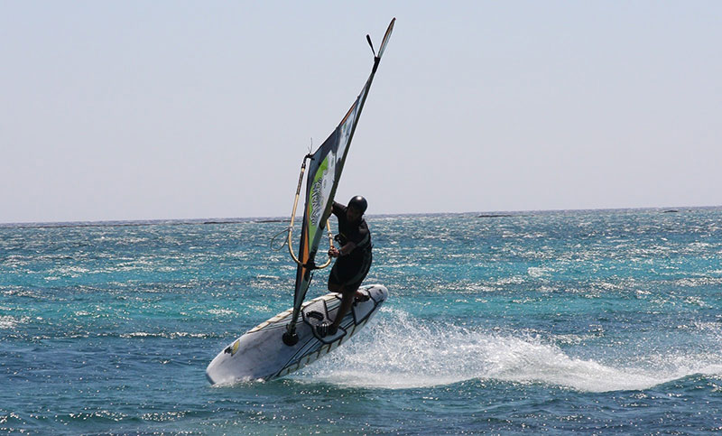 Wind surfing in the pink blue waters of Elafonisi